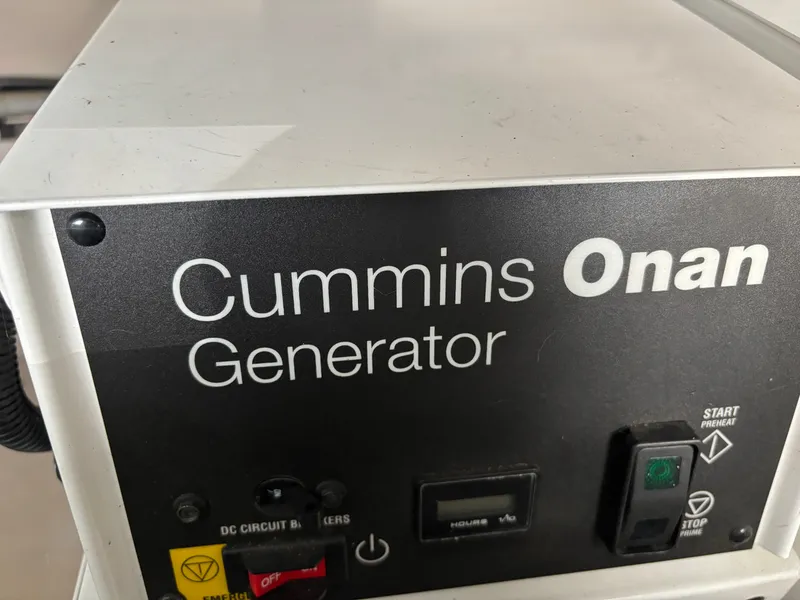 Slide: The Image of A Cummins Onan generator with various switches and indicators is visible. - 33