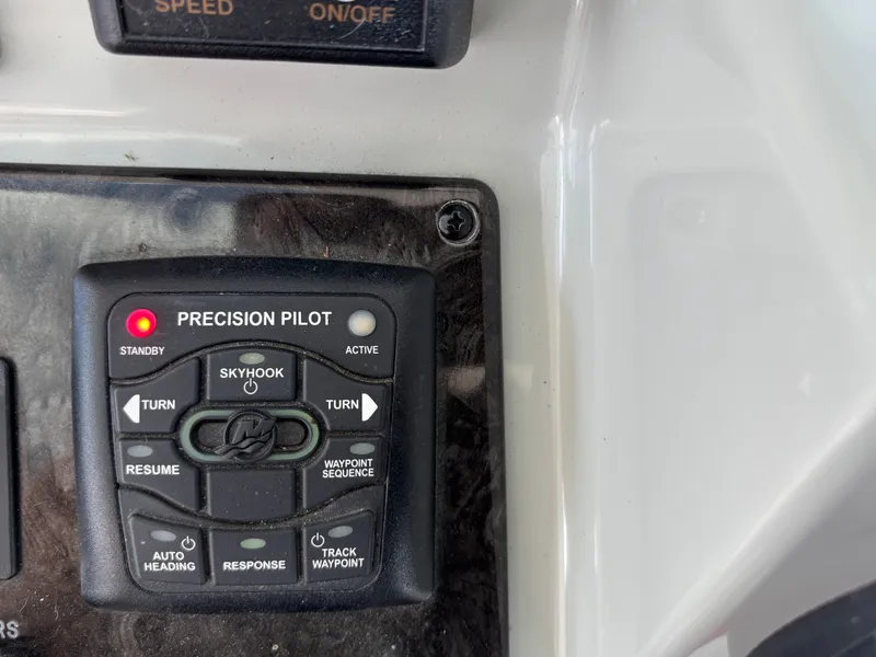 Slide: The Image of Close-up of a control panel featuring a Precision Pilot with Skyhook function. - 14