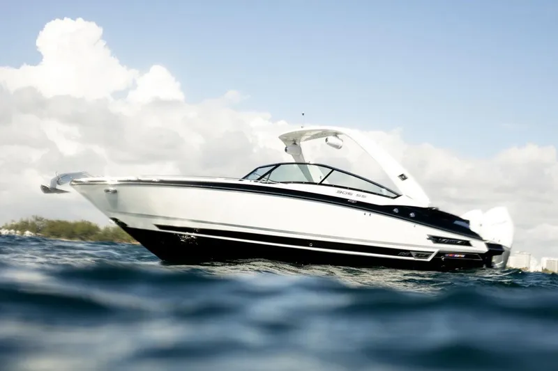 Slide: The Image of Manufacturer Provided Image: 2023 Monterey 305SS Super Sport boat on open water under a cloudy sky. - 2