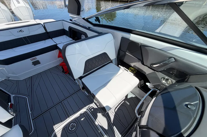 Slide: The Image of 2023 Monterey 305SS Super Sport boat interior with sleek seating and modern design. - 16
