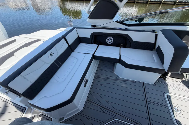 Slide: The Image of 2023 Monterey 305SS Super Sport boat interior with luxurious seating and sleek design. - 14