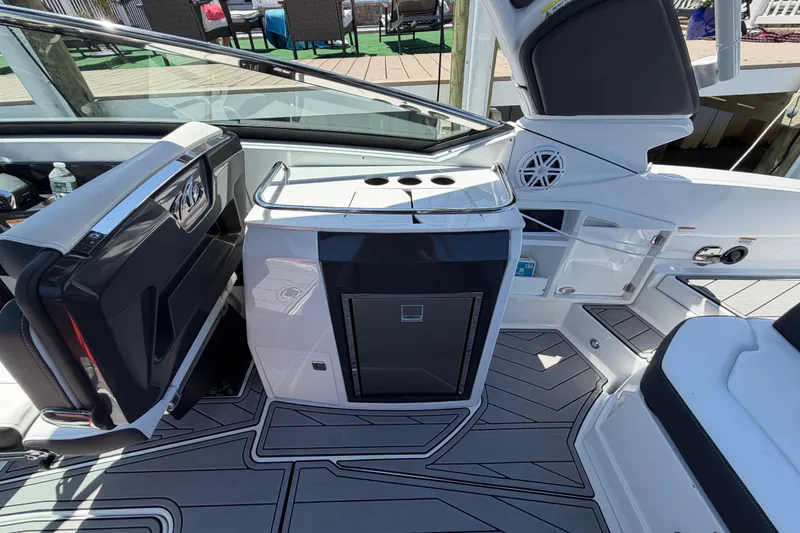 Slide: The Image of 2023 Monterey 305SS Super Sport boat interior with sleek design and modern amenities. - 18
