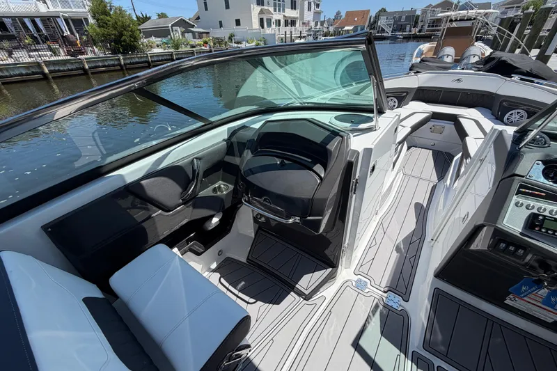 Slide: The Image of 2023 Monterey 305SS Super Sport boat interior with sleek seating and modern dashboard design. - 32