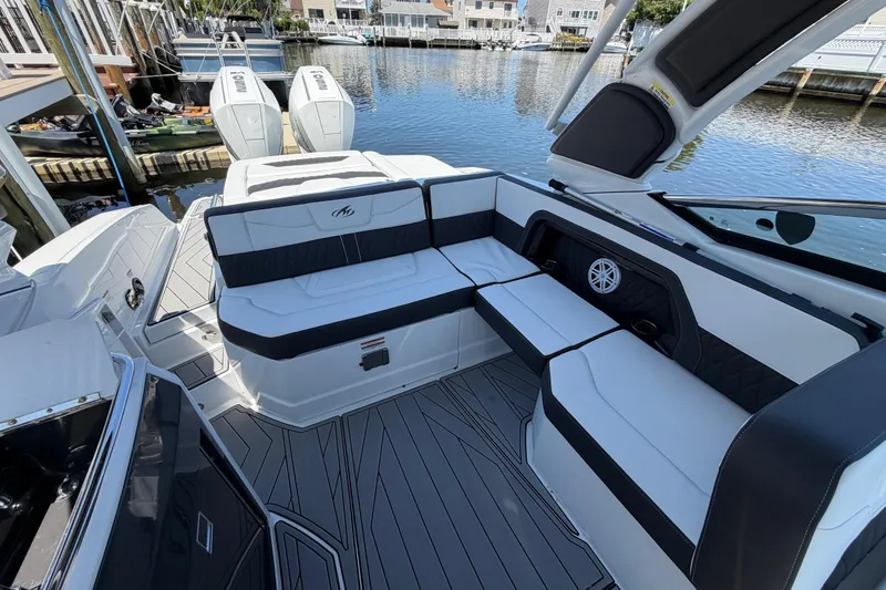 Slide: The Image of 2023 Monterey 305SS Super Sport boat interior with sleek seating and modern design. - 15