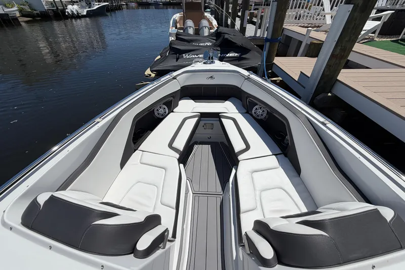 Slide: The Image of 2023 Monterey 305SS Super Sport boat interior with sleek seating and modern design. - 25