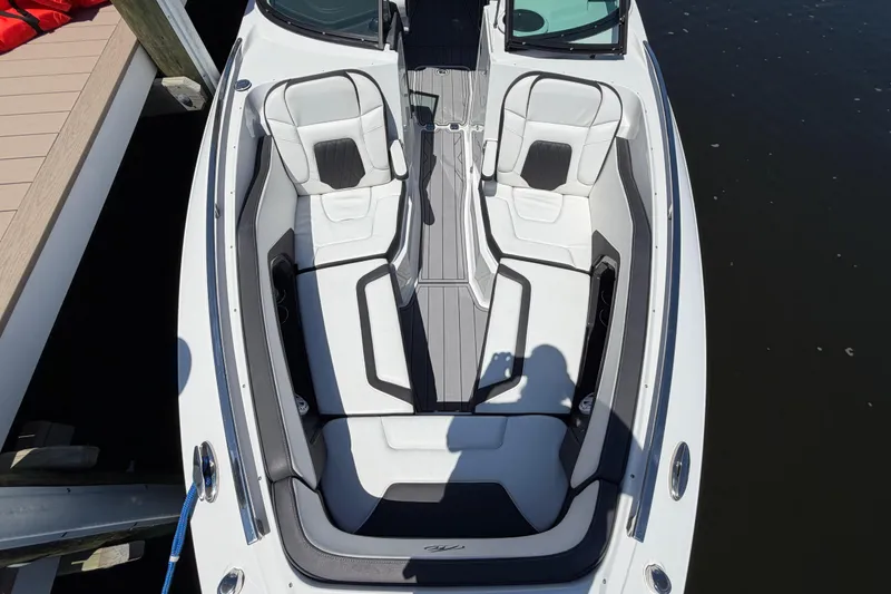 Slide: The Image of 2023 Monterey 305SS Super Sport boat interior with white seating and sleek design. - 26