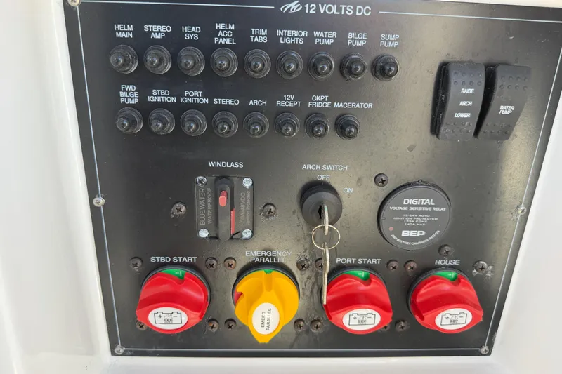 Slide: The Image of Control panel of a 2023 Monterey 305SS Super Sport boat with switches and dials. - 39