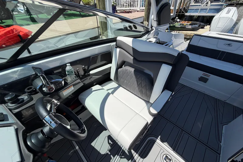Slide: The Image of 2023 Monterey 305SS Super Sport boat interior with modern helm and seating. - 21