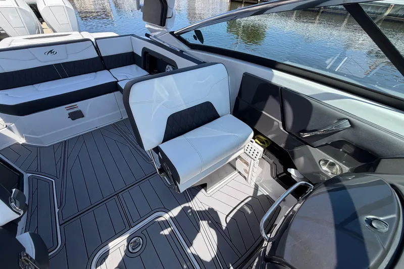 Slide: The Image of 2023 Monterey 305SS Super Sport boat interior with sleek seating and modern design. - 17