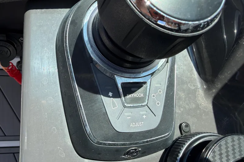 Slide: The Image of Control panel of 2023 Monterey 305SS Super Sport boat featuring Skyhook and adjust buttons. - 44
