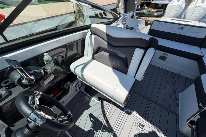 Slide: The Image of Interior of 2023 Monterey 305SS Super Sport boat with sleek seating and modern controls. - 20