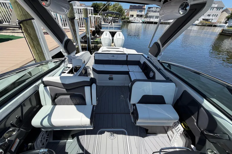 Slide: The Image of 2023 Monterey 305SS Super Sport boat interior with luxurious seating and modern design. - 28