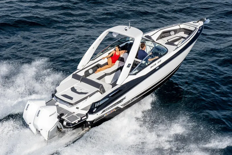 Slide: The Image of Manufacturer Provided Image: 2023 Monterey 305SS Super Sport boat cruising on open water, showcasing sleek design and performance. - 1
