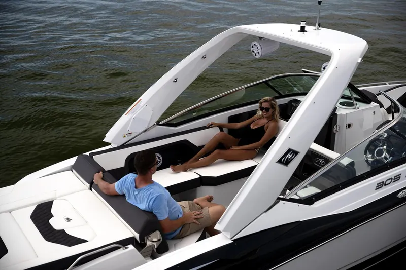 Slide: The Image of Manufacturer Provided Image: 2023 Monterey 305SS Super Sport boat with two people relaxing on deck. - 4