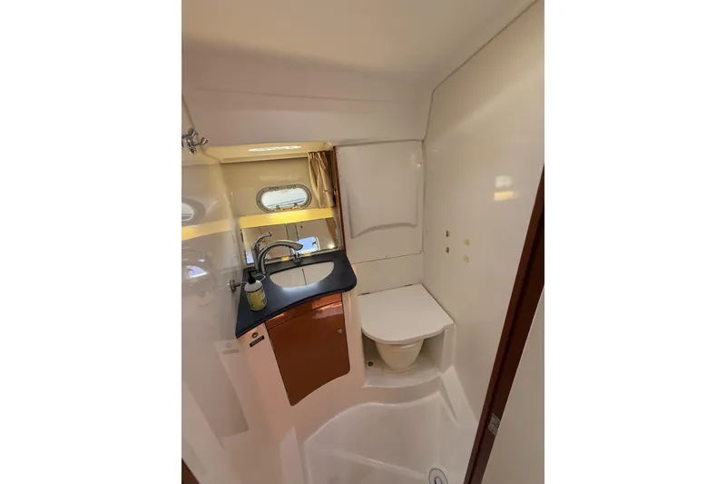 Slide: The Image of Bathroom interior of 2008 Beneteau Antares 13.80 yacht, featuring sink and toilet. - 23