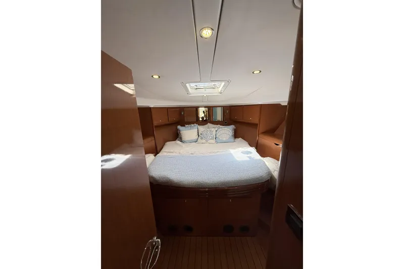 Slide: The Image of Luxurious cabin interior of 2008 Beneteau Antares 13.80 yacht with cozy bedding. - 21