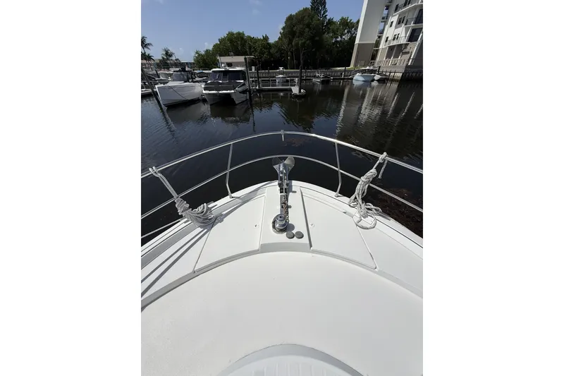 Slide: The Image of Bow view of 2008 Beneteau Antares 13.80 yacht docked in a marina. - 6