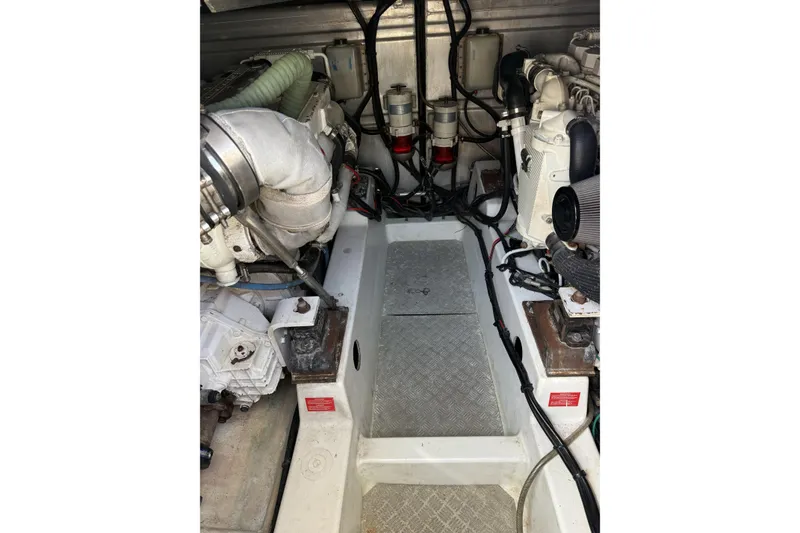 Slide: The Image of Engine room of 2008 Beneteau Antares 13.80, showcasing dual engines and mechanical components. - 24