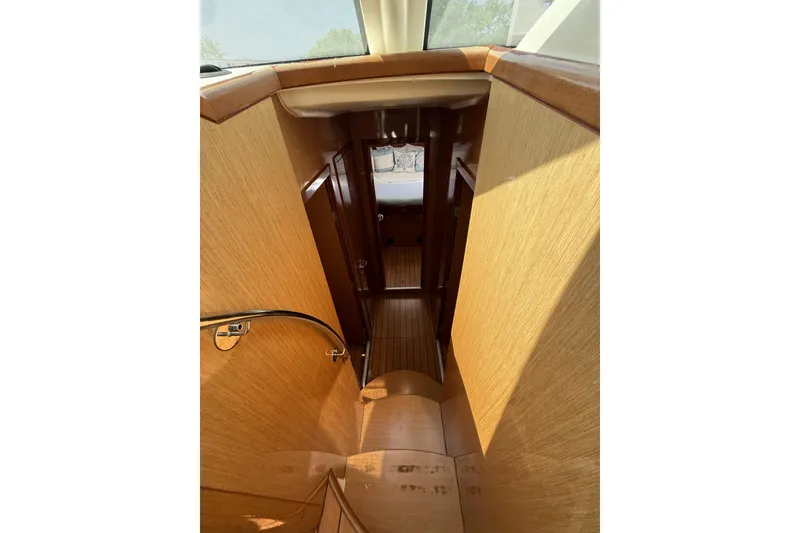 Slide: The Image of Interior view of 2008 Beneteau Antares 13.80 yacht with wooden staircase and cabin. - 17