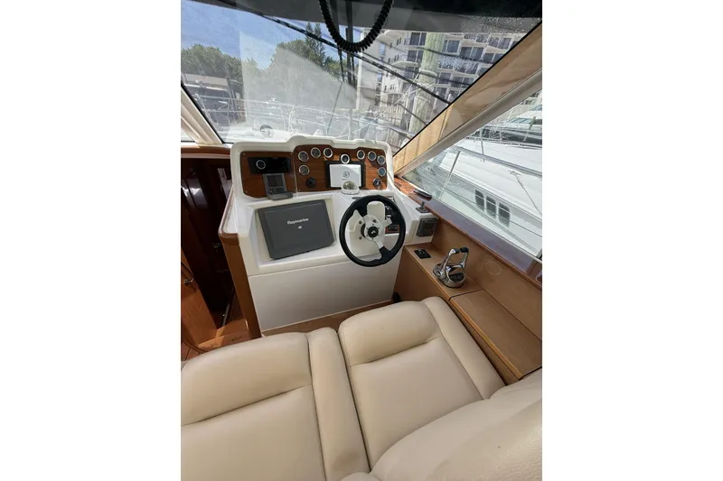 Slide: The Image of Helm of 2008 Beneteau Antares 13.80 with steering wheel and navigation equipment. - 15