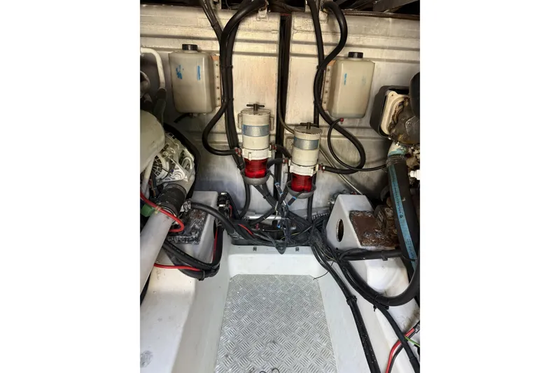 Slide: The Image of Engine room of 2008 Beneteau Antares 13.80 with visible wiring and components. - 29