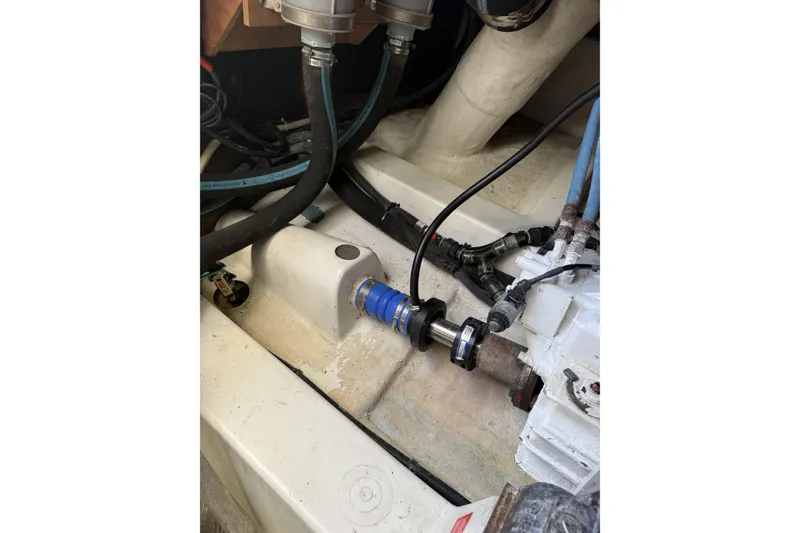 Slide: The Image of Engine compartment of a 2008 Beneteau Antares 13.80 with visible hoses and fittings. - 25