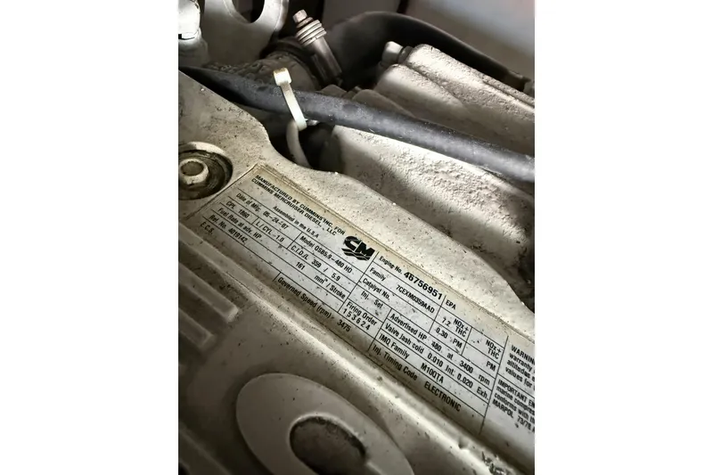 Slide: The Image of Close-up of a Cummins engine label on a 2008 Beneteau Antares 13.80 boat. - 31