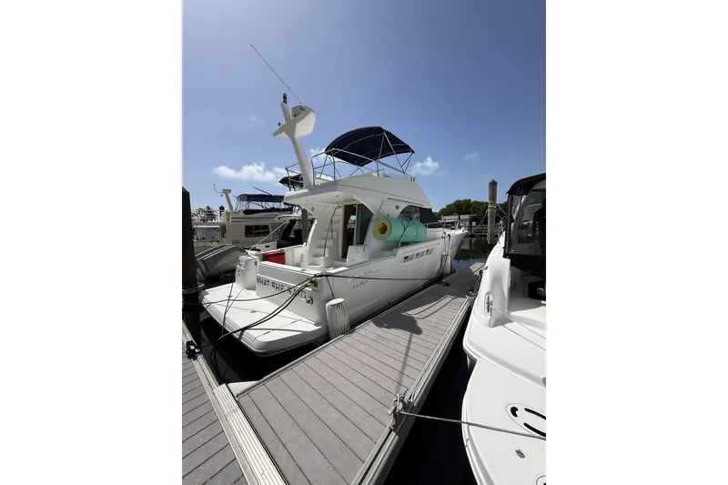 Slide: The Image of Beneteau Antares 13.80 yacht docked at marina, 2008 model, sunny day. - 2
