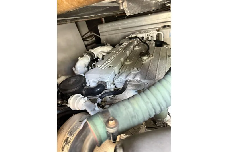 Slide: The Image of Engine compartment of a 2008 Beneteau Antares 13.80 boat, showcasing mechanical components. - 28
