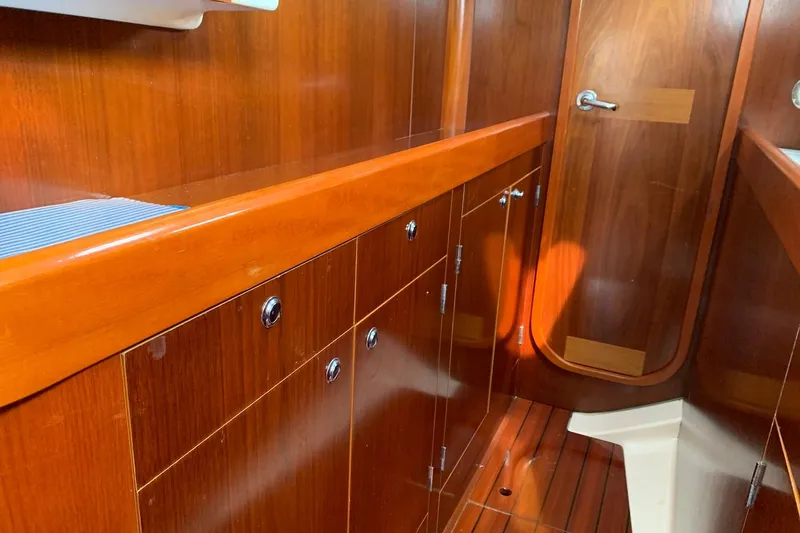 Slide: The Image of Pullman style galley with ample storage, leading to aft cabin - 17