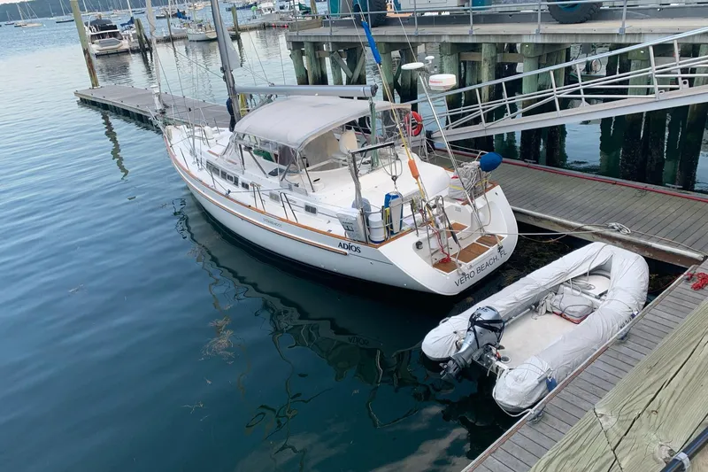 Slide: The Image of 1996 Beneteau Oceanis 40 CC sailboat docked with inflatable dinghy nearby. - 3