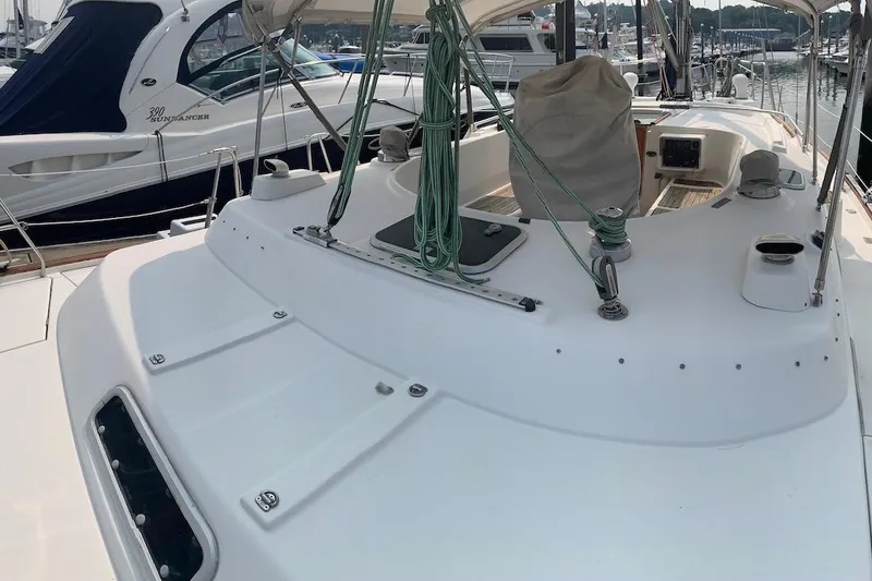 Slide: The Image of 1990 Beneteau Oceanis 390 sailboat deck with rigging, docked at marina. - 74