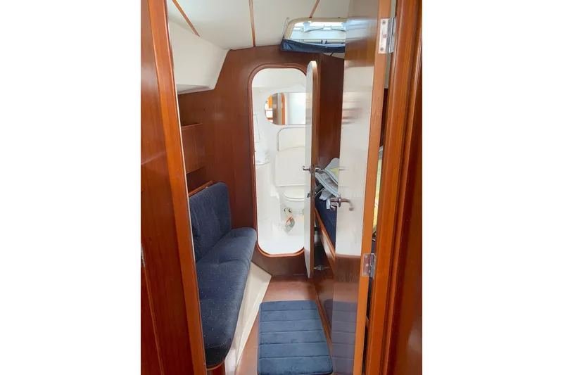Slide: The Image of Forward head, accessed by passing through pullman berth to starboard and single bench berth to port - 23