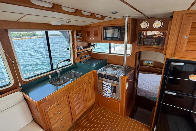 Slide: The Image of Interior of 2003 Pacific Seacraft 38T Fast Trawler with kitchen and cozy cabin view. - 117