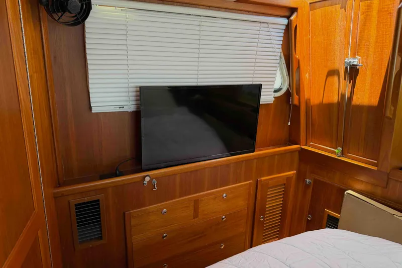 Slide: The Image of Interior of 2003 Pacific Seacraft 38T Fast Trawler with wood paneling and TV. - 100