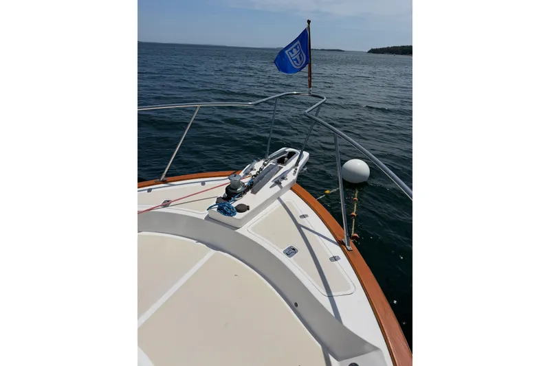 Slide: The Image of Bow view of 2003 Pacific Seacraft 38T Fast Trawler on calm waters. - 102