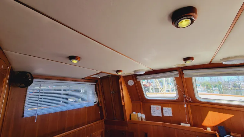 Slide: The Image of Interior of a 2003 Pacific Seacraft 38T Fast Trawler with wooden walls and windows. - 29