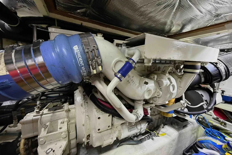 Slide: The Image of Engine room of a 2003 Pacific Seacraft 38T Fast Trawler with visible components. - 140