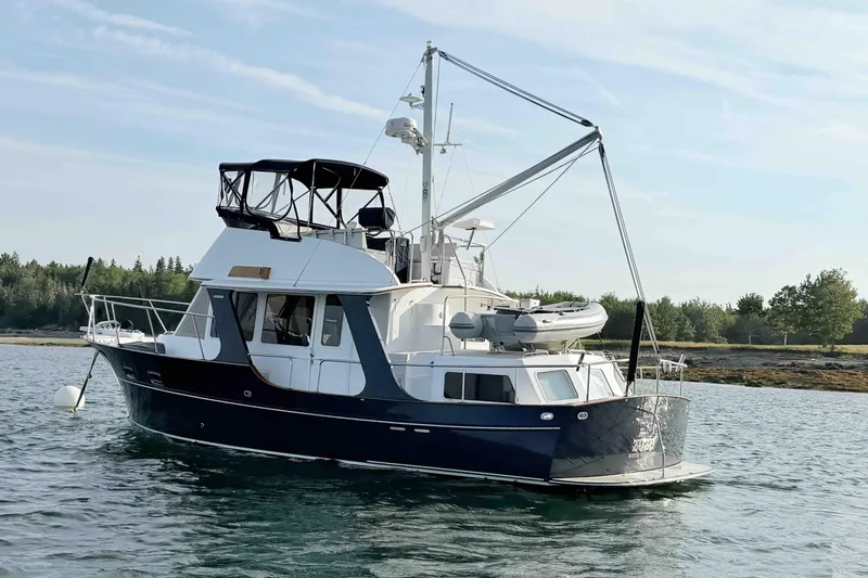 Slide: The Image of Pacific Seacraft 38T Fast Trawler, 2003 model, anchored on calm water. - 122