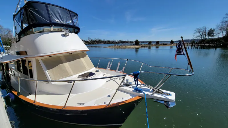 Slide: The Image of A 2003 Pacific Seacraft 38T Fast Trawler docked on calm water under a clear sky. - 36