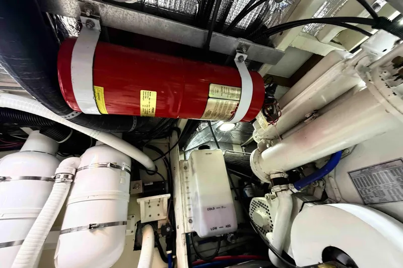 Slide: The Image of Engine room of 2003 Pacific Seacraft 38T Fast Trawler with fire extinguisher and machinery. - 155