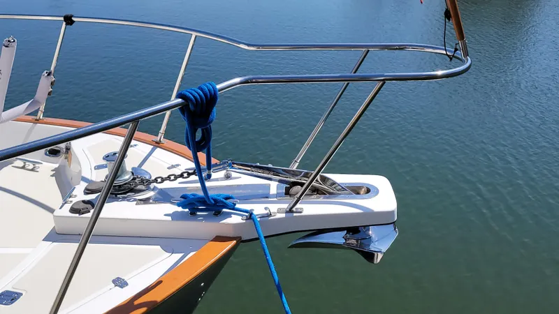 Slide: The Image of The bow of a 2003 Pacific Seacraft 38T Fast Trawler with anchor and blue rope. - 14