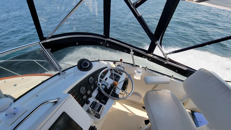 Slide: The Image of The cockpit of a 2003 Pacific Seacraft 38T Fast Trawler with helm and instruments. - 10