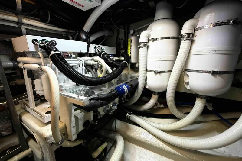 Slide: The Image of Engine room of 2003 Pacific Seacraft 38T Fast Trawler with complex piping and machinery. - 148