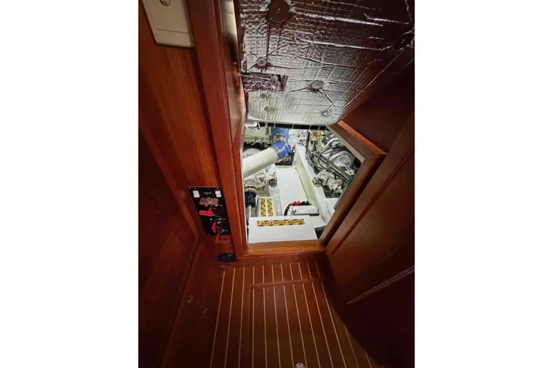 Slide: The Image of Engine room of 2003 Pacific Seacraft 38T Fast Trawler, showcasing mechanical components. - 137