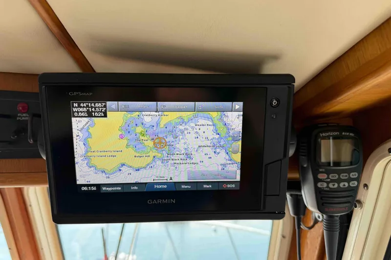 Slide: The Image of Garmin GPS display on 2003 Pacific Seacraft 38T Fast Trawler, showing nautical map and coordinates. - 94