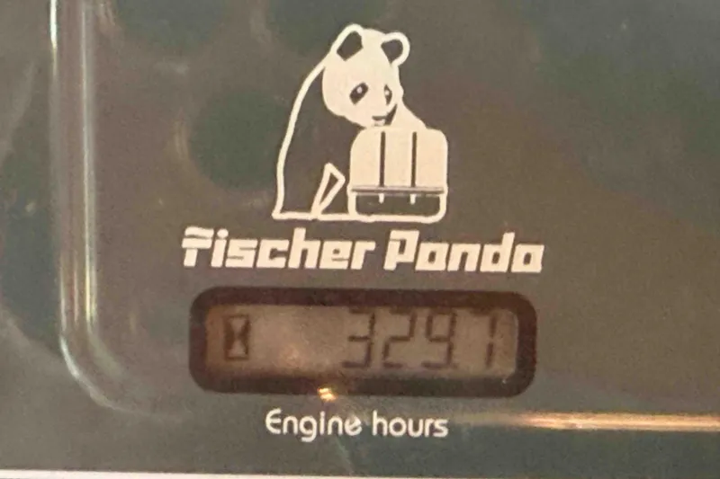 Slide: The Image of Fischer Panda engine hour meter displaying 3297 hours on Pacific Seacraft 38T Fast Trawler, 2003 model. - 97