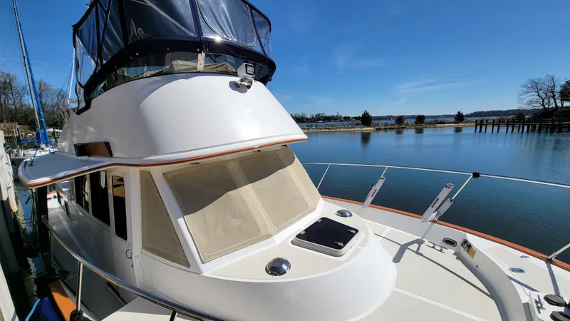 Slide: The Image of A 2003 Pacific Seacraft 38T Fast Trawler docked on calm waters. - 43