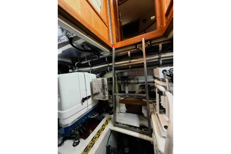 Slide: The Image of Engine room of 2003 Pacific Seacraft 38T Fast Trawler with ladder and equipment. - 156