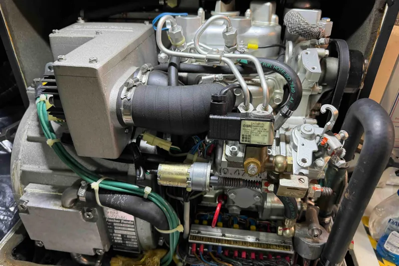 Slide: The Image of Engine compartment of a 2003 Pacific Seacraft 38T Fast Trawler, showcasing detailed components. - 80